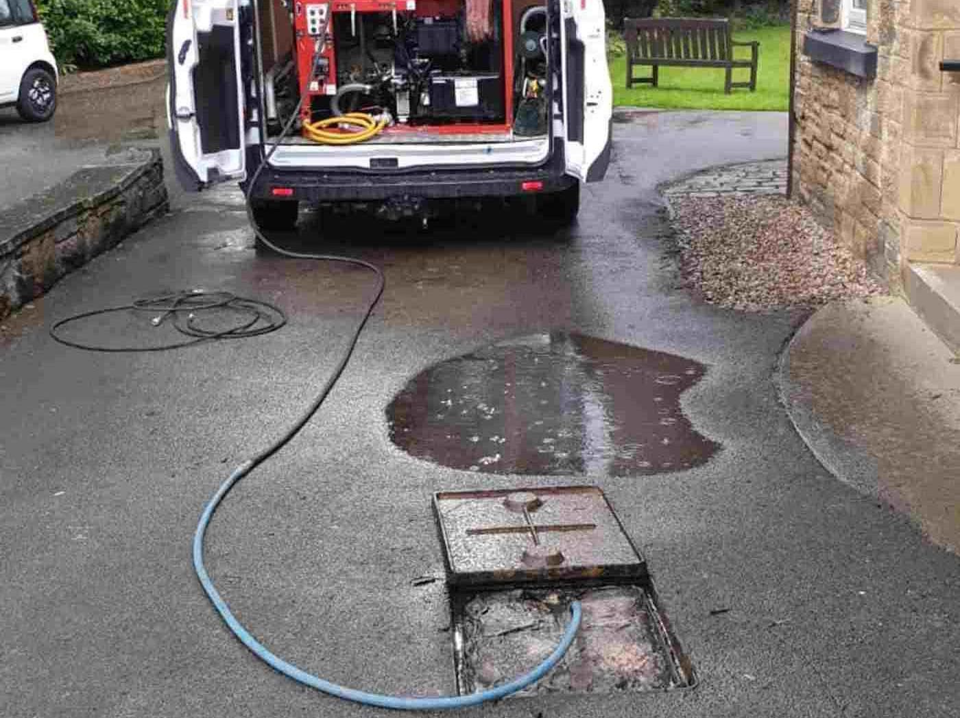 Blocked drain being cleared